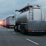 truck driving on highway hauling oil products