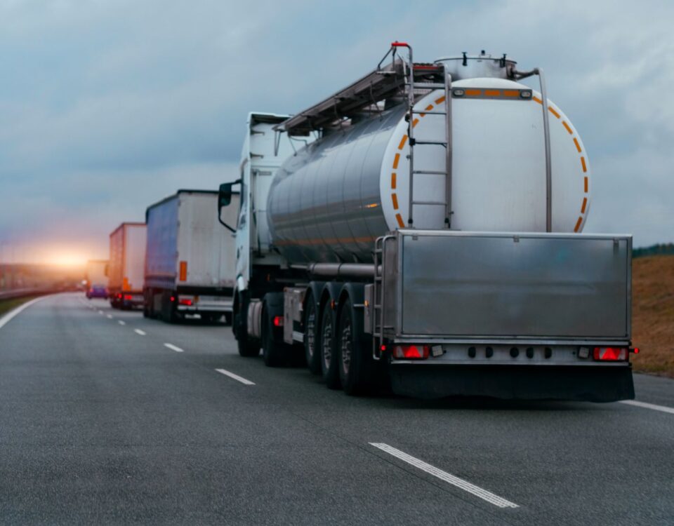 truck driving on highway hauling oil products
